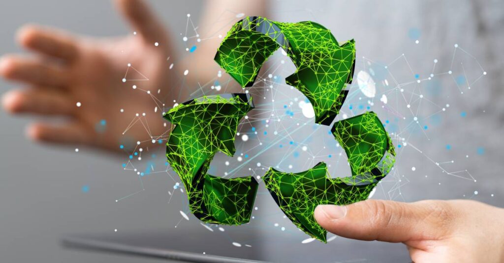 A 3D green recycling sign is hovering over a grey tablet. Blue and white designs surround the recycling sign.