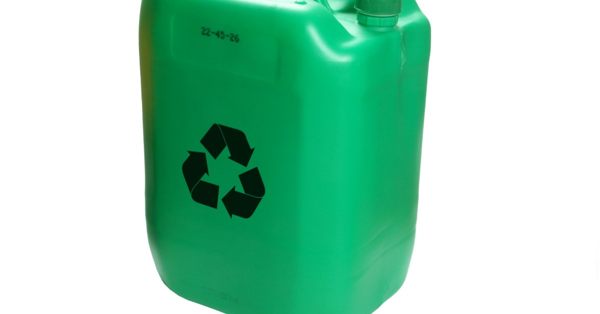 A plain, green jug features three black arrows that appear in a circle, symbolizing recycling. It sits on a white background.